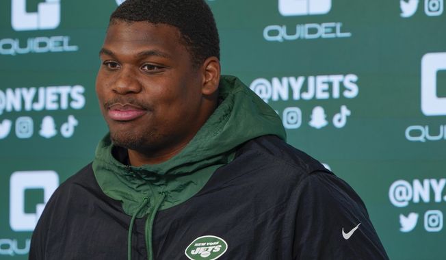 FILE - New York Jets&#x27; Quinnen Williams speaks to reporters after a practice at the NFL football team&#x27;s training facility in Florham Park, N.J., Tuesday, May 24, 2022. Jets All-Pro defensive tackle Quinnen Williams is not attending the start of the team&#x27;s voluntary workouts while he seeks a contract extension, according to a person with knowledge of the situation. Williams’ absence Monday, April 17, 2023, was expected after he said in January he wouldn’t participate without a new contract. (AP Photo/Seth Wenig, File)