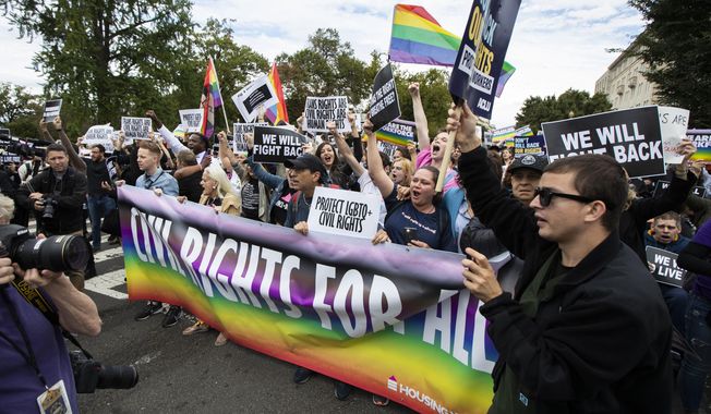 Supporters of LGBTQ rights stage a protest on the street in front of the U.S. Supreme Court on Oct. 8, 2019, in Washington. (AP Photo/Manuel Balce Ceneta, File)