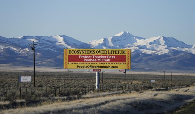 A billboard displays &quot;Protect Thacker Pass&quot; near the Fort McDermitt Paiute-Shoshone Indian Reservation on April 25, 2023, near McDermitt, Nev. The 9th U.S. Circuit Court of Appeals on Monday, July 17, 2023, rejected the latest bid by conservationists and tribal leaders to block construction of a huge lithium mine already in the works along the Nevada-Oregon line. (AP Photo/Rick Bowmer, File)