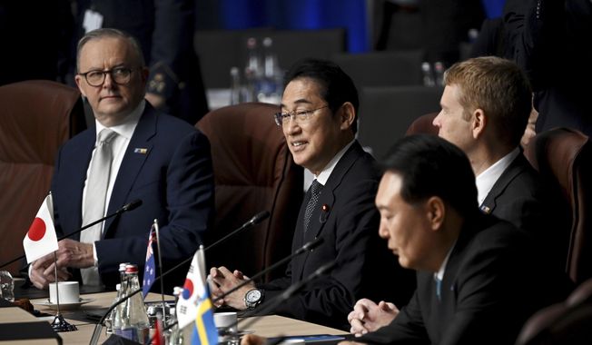 Left to right, Australia&#x27;s Prime Minister Anthony Albanese, Japan&#x27;s Prime Minister Fumio Kishida, New Zealand&#x27;s Prime Minister Chris Hipkins, and South Korean President Yoon Suk Yeol, attend a meeting of the North Atlantic Council with Partner Nations at a NATO summit in Vilnius, Lithuania, Wednesday, July 12, 2023. (Paul Ellis/Pool Photo via AP)
