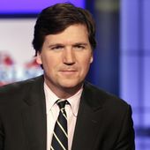 Tucker Carlson, then-host of &quot;Tucker Carlson Tonight,&quot; poses for photos in a Fox News Channel studio, March 2, 2017, in New York. (AP Photo/Richard Drew, File)