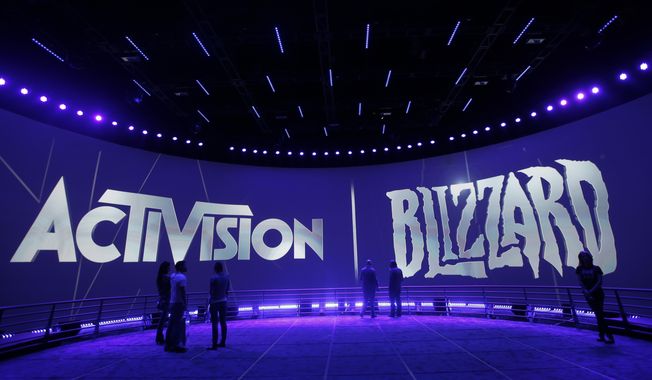 The Activision Blizzard Booth during the Electronic Entertainment Expo, June 13, 2013, in Los Angeles. On Monday, June 12, 2023, the Federal Trade Commission sued to block Microsoft from completing its deal to buy video game company Activision Blizzard, the latest antitrust challenge to the proposed merger but one that could hasten its conclusion. (AP Photo/Jae C. Hong, File)