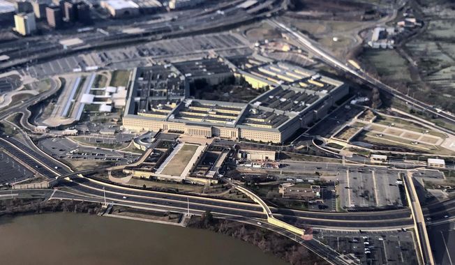 The Pentagon is seen in this aerial view made through an airplane window in Washington, Jan. 26, 2020. U.S. officials tell The Associated Press the number of reported sexual assaults across the military inched up by about 1% last year, as a sharp decline in Army numbers offset large increases in the other three services. (AP Photo/Pablo Martinez Monsivais, File)