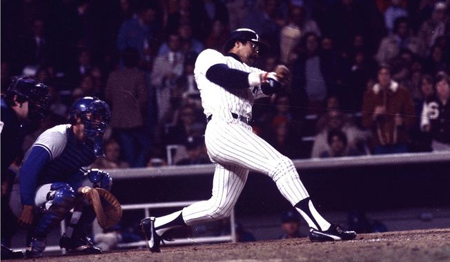 Yankees&#x27; slugger Reggie Jackson connects for his third home run in the eighth inning off a pitch from the Dodgers&#x27; Charlie Hough during game 6 of the World Series against the Los Angeles Dodgers at Yankee Stadium in New York on Oct. 18, 1977.  New York won the game 8-4, for their 21st World Series championship.  (AP Photo)