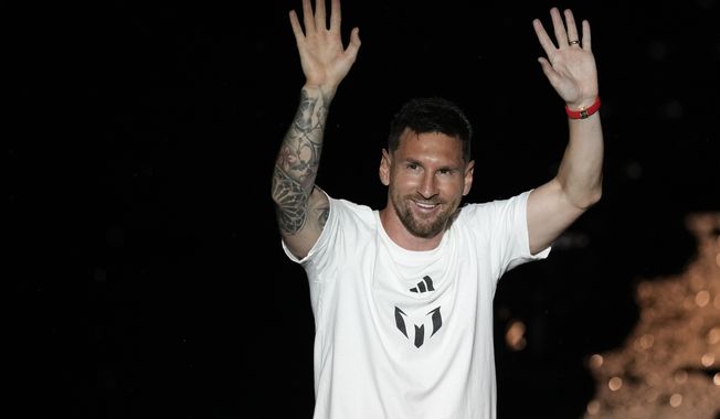 International superstar Lionel Messi waves to fans as he is introduced during a celebration at DRV Pink Stadium, Sunday, July 16, 2023, in Fort Lauderdale, Fla. (AP Photo/Rebecca Blackwell)