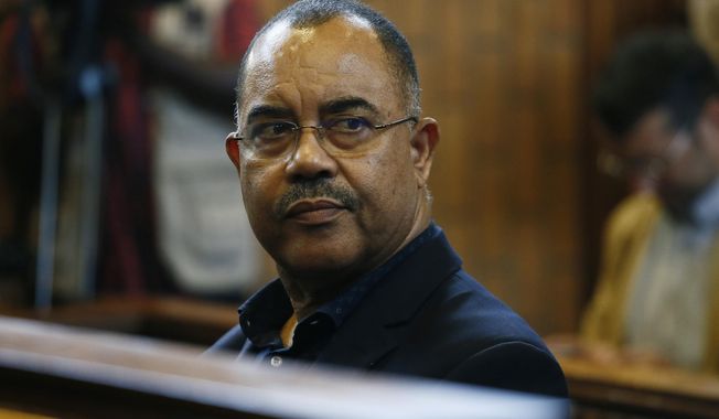 Former Mozambican Finance Minister Manuel Chang sits in court in Kempton Park, Johannesburg, South Africa, on Jan. 8, 2019. Chang who has been held in prison in South Africa for nearly five years was on Wednesday July 12, 2023 extradited to the United States to face a fraud and corruption trial over a $2 billion scandal involving fraudulent government loans. (AP Photo/Phill Magakoe, File)