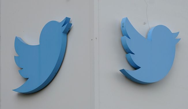Twitter logos hang outside the company&#x27;s offices in San Francisco, Monday, Dec. 19, 2022. (AP Photo/Jeff Chiu, File)