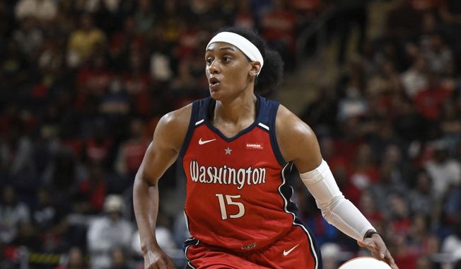 Washington Mystics guard Brittney Sykes (15) handles the ball during the second half of a WNBA basketball game against the New York Liberty, Friday, May 19, 2023, in Washington. (AP Photo/Terrance Williams) **FILE**