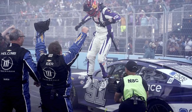 Shane Van Gisbergen celebrates after winning a NASCAR Cup Series auto race at the Grant Park 220 Sunday, July 2, 2023, in Chicago. (AP Photo/Morry Gash)