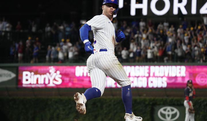 Chicago Cubs&#x27; Nico Hoerner runs the bases after hitting a grand slam against the Washington Nationals during the eighth inning of a baseball game in Chicago, Wednesday, July 19, 2023. (AP Photo/Nam Y. Huh)