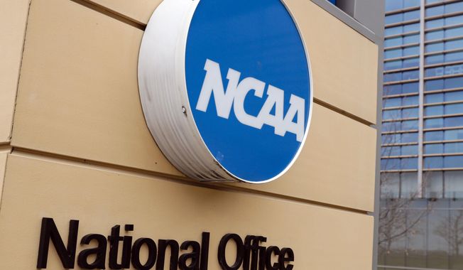 Signage at the headquarters of the NCAA is viewed in Indianapolis, March 12, 2020. The NCAA has changed its reinstatement process for athletes involved in sports wagering. (AP Photo/Michael Conroy, File)