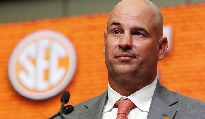 FILE - Then-Tennessee NCAA college football head coach Jeremy Pruitt speaks during Southeastern Conference Media Days in Atlanta, July 18, 2018. The NCAA fined Tennessee more than $8 million on Friday, July 14, 2023, and issued a scathing report outlining more than 200 infractions during the three-year tenure of former coach Jeremy Pruitt. The Volunteers escaped a postseason ban.(AP Photo/John Bazemore, File)