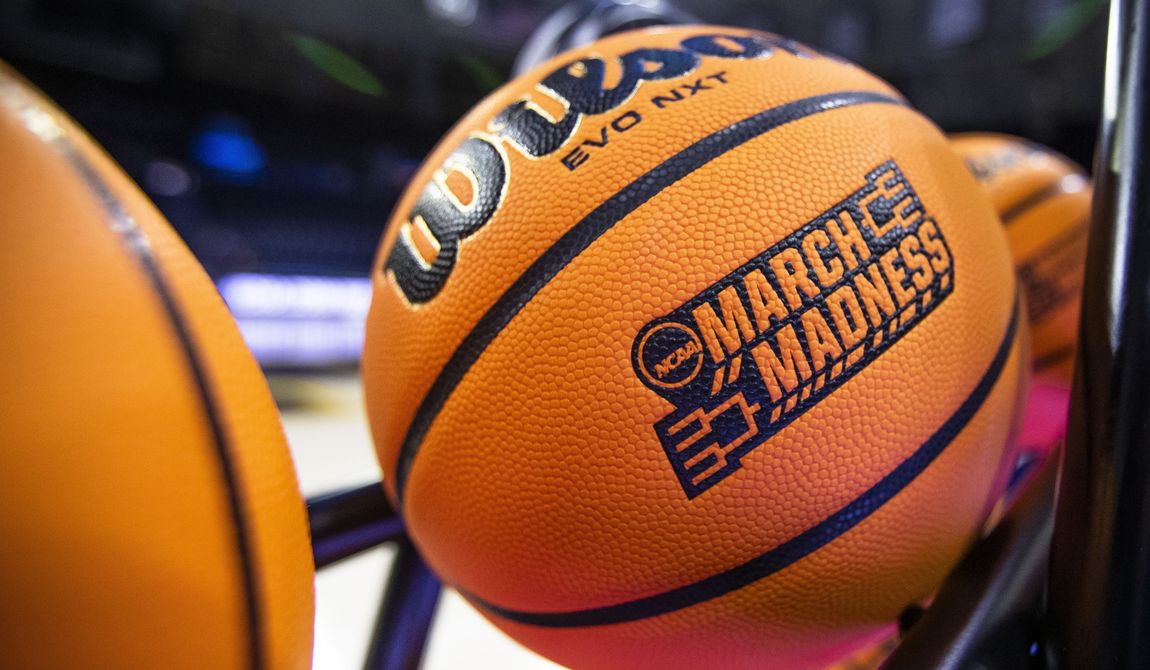 A basketball with a March Madness logo rests on a rack before a First Four game between Illinois and Mississippi State in the NCAA women&#x27;s basketball tournament Wednesday, March 15, 2023, in South Bend, Ind.  (AP Photo/Michael Caterina, File) **FILE**