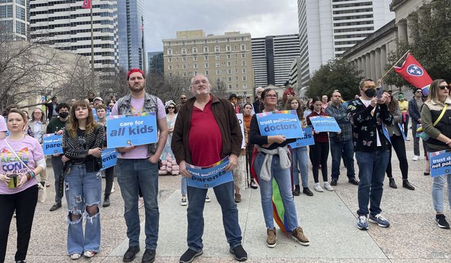 Advocates gather for a rally at the state Capitol complex in Nashville, Tenn., to oppose a series of bills that target the LGBTQ community, Tuesday, Feb. 14, 2023. Bans on gender-affirming care for minors are to take effect Saturday in Georgia and Tennessee. (AP Photo/Jonathan Mattise, File)