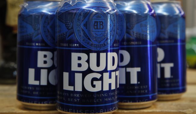 Cans of Bud Light beer are seen on Thursday, Jan. 10, 2019, in Washington. On Friday, April 7, 2023, The Associated Press reported on stories circulating online incorrectly claiming Anheuser-Busch fired its entire marketing department in response to its partnership with a transgender influencer and the rollout of LGBTQ Pride-themed Bud Light cans that feature various pronouns. (AP Photo/Jacquelyn Martin) **FILE**