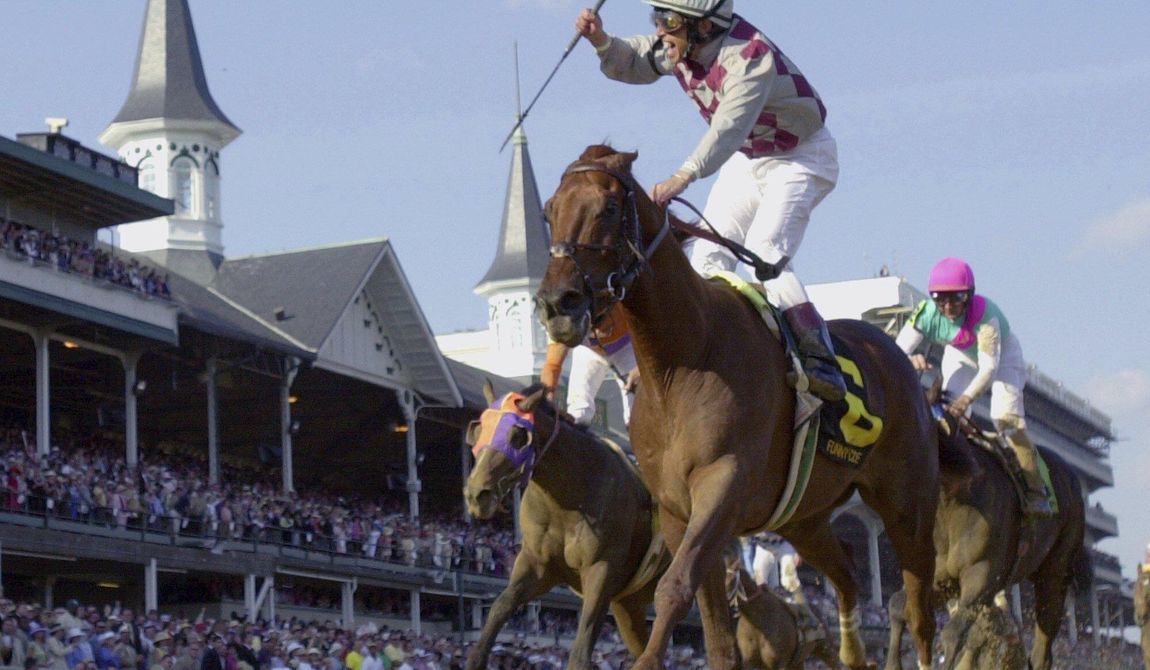 Jockey Jose Santos celebrates aboard Funny Cide after crossing the finish line to win the 129th running of the Kentucky Derby at Churchill Downs on May 3, 2003, in Louisville, Ky. Cide, the “Gutsy Gelding” who became a fan favorite after winning the Kentucky Derby and Preakness in 2003, has died of complications resulting from colic on Sunday, July 16, 2023. He was 23. (AP Photo/Al Behrman, File)