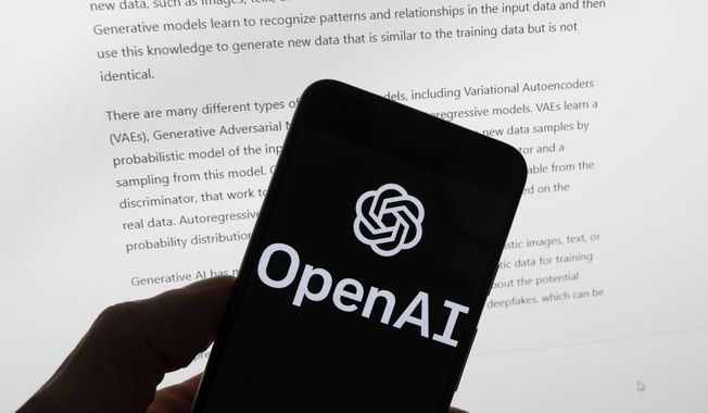 The OpenAI logo is seen on a mobile phone in front of a computer screen displaying output from ChatGPT, March 21, 2023, in Boston. The U.S. Federal Trade Commission has launched an investigation into ChatGPT creator OpenAI and whether the artificial intelligence company violated consumer protection laws by scraping public data and publishing false information through its chatbot, according to reports in the Washington Post and the New York Times. (AP Photo/Michael Dwyer, File)
