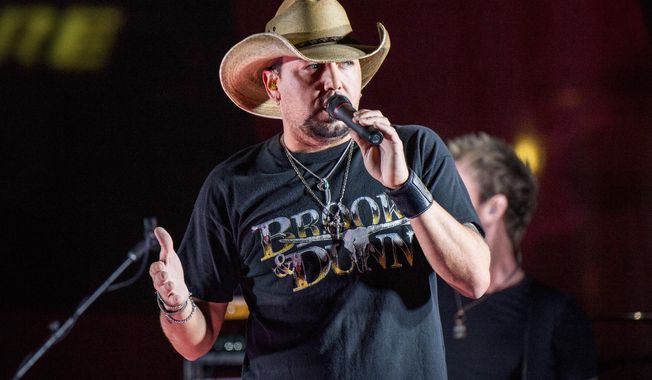 In this June 7, 2017 file photo Jason Aldean performs during a surprise pop up concert at the Music City Center in Nashville, Tenn. Aldean’s moving rendition of Tom Petty&#x27;s “I Won’t Back Down” on “Saturday Night Live” earlier this month will soon be raising money to help victims of the Las Vegas shooting. Aldean’s representative says all proceeds from the released song will be donated to the Direct Impact Fund dedicated to victims of the tragedy. (Photo by Amy Harris/Invision/AP, File)
