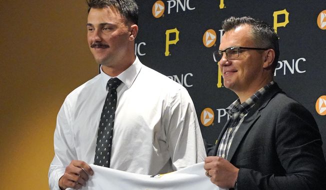 Pittsburgh Pirates first round draft pick, pitcher Paul Skenes, left, poses with Pirates general manager Ben Cherington after signing with the team in Pittsburgh, Tuesday, July 18, 2023. The Pirates drafted Skenes first player overall in this year&#x27;s Major League Baseball draft. (AP Photo/Gene J. Puskar)