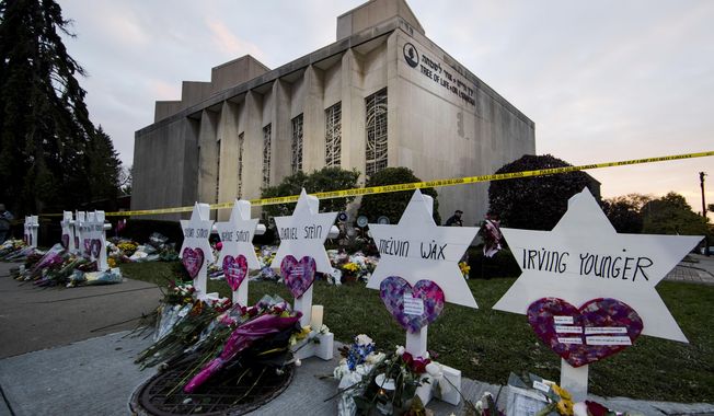 A makeshift memorial stands outside the Tree of Life Synagogue in the aftermath of a deadly shooting in Pittsburgh, Oct. 29, 2018. (AP Photo/Matt Rourke, File)