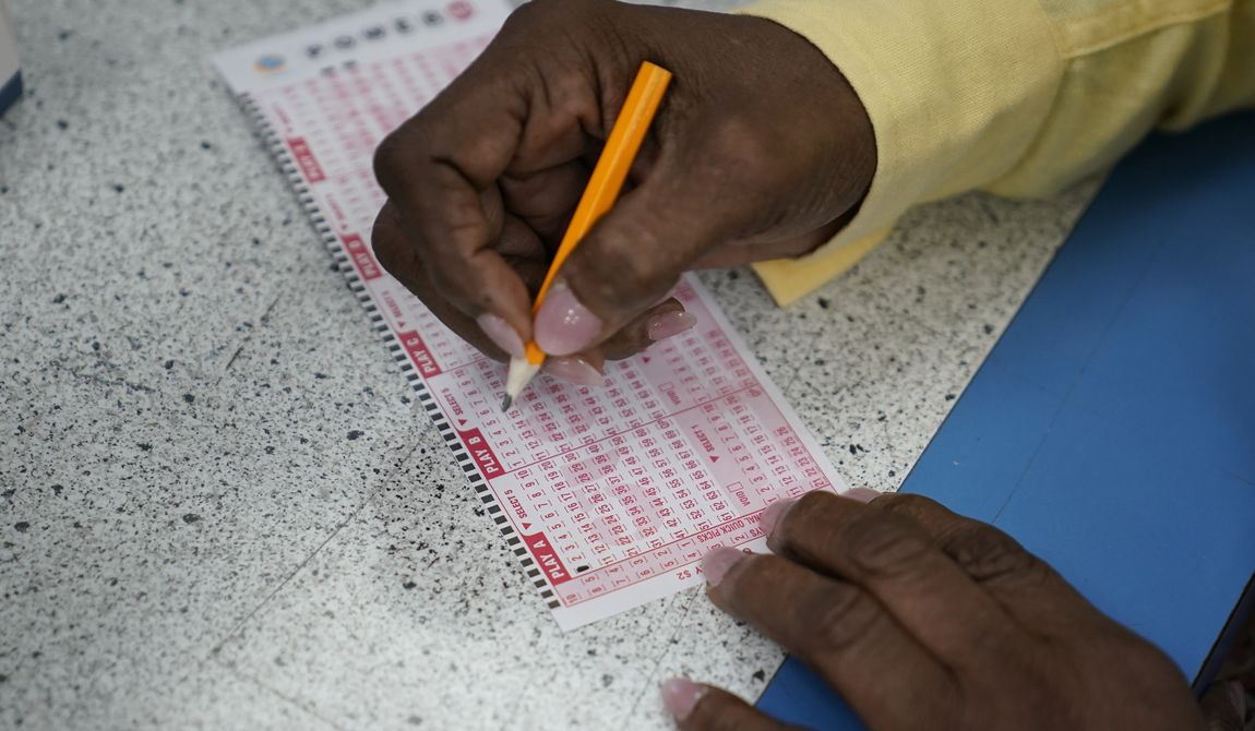 A customer fills out a Powerball ticket, Wednesday, July 19, 2023, in Hawthorne, Calif.  The new jackpot for Wednesday’s Powerball drawing would be the seventh highest in U.S. history and the third largest for the game.  (AP Photo/Ryan Sun)