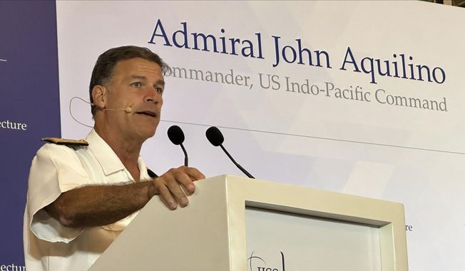 In this photo released by IISS on Thursday, March 16, 2023, Admiral John Aquilino delivers a speech at a think tank in Singapore where he will speak on the topic of &#x27;Managing Strategic Competition and the Quest for an Enduring Future in the Indo-Pacific. United States Indo-Pacific Command chief Adm. John Aquilino said Thursday that Washington does not seek to contain China, nor seek conflicts in the region, but it would take action to support the region against coercion and bullying by authoritarian regimes. (IISS via AP)