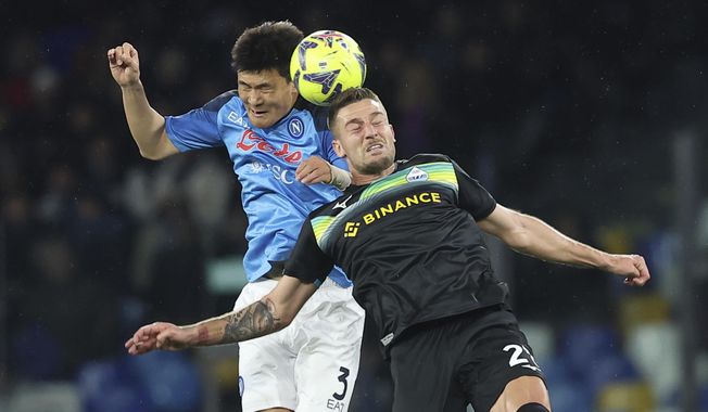 Napoli&#x27;s Kim Min-Jae, left, battles for a head ball with Lazio&#x27;s Elseid Hysaj during the Serie A soccer match between Napoli and Lazio, at the Diego Armando Maradona stadium in Naples, Italy, on March 3, 2023. Bayern Munich has signed South Korean defender Kim Min-jae from Italian champion Napoli for a reported fee of 50 million euros ($55 million). The Bavarian powerhouse said Tuesday that the 26-year-old Kim signed a five-year deal through June 2028 and will wear the No. 3. (Alessandro Garofalo/LaPresse via AP, File)