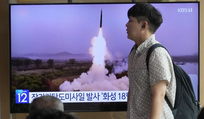 A TV screen shows a file image of North Korea&#x27;s missile launch during a news program at the Seoul Railway Station in Seoul, South Korea, Wednesday, July 12, 2023. North Korea launched a long-range ballistic missile toward its eastern waters Wednesday, its neighbors said, two days after the North threatened &quot;shocking&quot; consequences to protest what it called a provocative U.S. reconnaissance activity near its territory. (AP Photo/Ahn Young-joon)