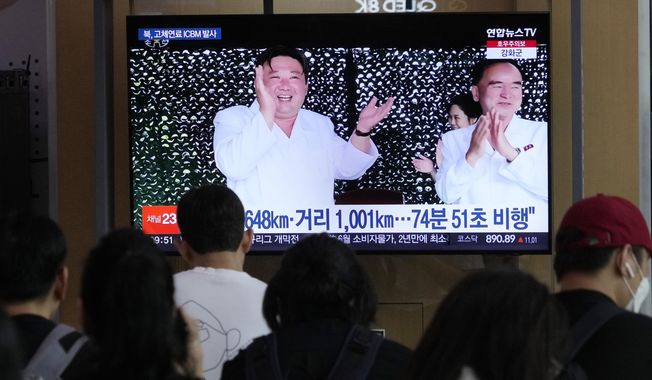 A TV screen shows an image of North Korean leader Kim Jong-un, left, during a news program, at the Seoul Railway Station in Seoul, South Korea, Thursday, July 13, 2023. Kim vowed to further bolster his country&#x27;s nuclear fighting capabilities as he supervised the second test-flight of a new intercontinental ballistic missile designed to strike the mainland U.S., state media reported Thursday. (AP Photo/Ahn Young-joon)