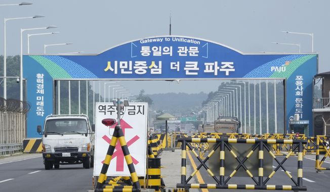 Barricades are placed near the Unification Bridge, which leads to the Panmunjom in the Demilitarized Zone in Paju, South Korea, Wednesday, July 19, 2023. An American soldier who had served nearly two months in a South Korean prison, fled across the heavily armed border into North Korea, U.S. officials said Tuesday, becoming the first American detained in the North in nearly five years. (AP Photo/Ahn Young-joon)