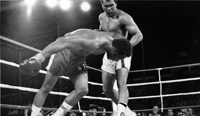 FILE - Challenger Muhammad Ali, right, watches as defending world champion George Foreman goes down to the canvas in the eighth round of their WBA/WBC championship match, on Oct. 30, 1974, in Kinshasa, Zaire. A mint condition Mickey Mantle baseball card has sold for $12.6 million, blasting into the record books Sunday Aug. 28, 2022 as the most expensive ever paid for a piece of sports memorabilia. It easily surpassed the $6.2 million for the heavyweight boxing belt reclaimed by Muhammad Ali during 1974&#x27;s “Rumble in the Jungle.” (AP Photo/Richard Drew, File)