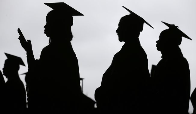 In this May 17, 2018, file photo, new graduates line up before the start of the Bergen Community College commencement at MetLife Stadium in East Rutherford, N.J. (AP Photo/Seth Wenig, File)