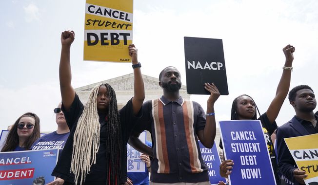 D’Aungillique Jackson, a community organizer and recent graduate of Fresno State University, third from left, joins Jordan Braithwaite, 21, an undergrad at Grambling State University, second from right, and others demonstrating outside the Supreme Court, Friday, June 30, 2023, in Washington. Jackson says she has student loans of roughly $20,000. “I’m affected by all three rulings,” says Jackson, “as a Black queer woman, each one of my identities are under attack. It’s heartbreaking.” (AP Photo/Jacquelyn Martin)