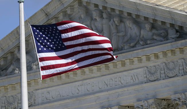 An American flag waves in front of the Supreme Court building, Nov. 2, 2020, on Capitol Hill in Washington. The American Civil Liberties Union asked the Supreme Court this week to review a lower court’s ruling against boycotting Israel, arguing the restriction impedes on First Amendment rights. (AP Photo/Patrick Semansky, File)