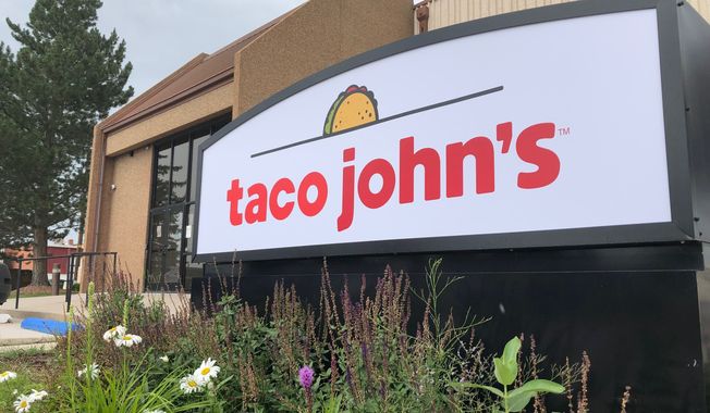 A sign stands outside the corporate headquarters of Cheyenne-based Taco John&#x27;s, Aug. 1, 2019, in Cheyenne, Wyo. Taco Bell rang up a win Tuesday, July 18, 2023, in its quest to make “Taco Tuesday&quot; free of trademark restrictions, with Taco John’s formally abandoning its decades-old claim to own the phrase amid a challenge from its bigger rival. (AP Photo/Mead Gruver, File)