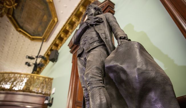 A statue of Thomas Jefferson holding the Declaration of Independence stands in New York&#x27;s City Hall Council Chamber on Wednesday, October 20, 2021. The 1833 statue of Jefferson will be removed from the council chamber by the end of the year. Some New York City Council members have called for years to remove the statue from the room where they conduct business because Jefferson was a slaveholder. (AP Photo/Ted Shaffrey)