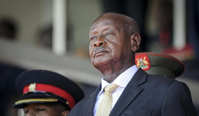FILE - Uganda&#x27;s President Yoweri Museveni attends the state funeral of Kenya&#x27;s former president Daniel Arap Moi in Nairobi, Kenya on Feb. 11, 2020. Uganda&#x27;s President Yoweri Museveni fired his son Muhoozi Kainerugaba as commander of the nation&#x27;s infantry forces Tuesday, Oct. 4, 2022 after the son tweeted an unprovoked threat to capture the capital of neighboring Kenya, drawing widespread concern in East Africa. (AP Photo/John Muchucha, File)