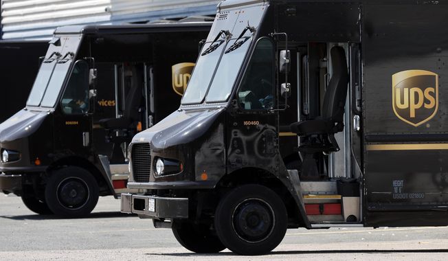 United Parcel Service trucks are seen parked at a distribution facility, Friday, June 30, 2023, in Boston. A little more than a week after contract talks between UPS and the union representing 340,000 of its workers broke down, UPS said Friday, July 14, 2023, it will begin training many of its non-union employees in the U.S. to step in should there be a strike, which the union has vowed to do if no agreement is reached by the end of this month. (AP Photo/Michael Dwyer, File)