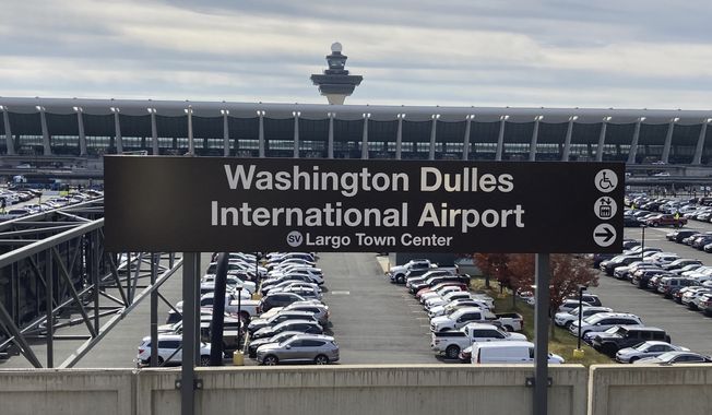 The Metrorail station at Dulles International Airport is seen on Nov. 2, 2022, in Chantilly, Va., with the terminal in the background. (AP Photo/Matthew Barakat) **FILE**