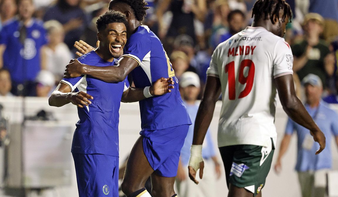 Chelsea&#x27;s Ian Maatson, left, celebrates a goal with Nicolas Jackson, center, while Wrexham&#x27;s Jacob Mendy (19) walks past during the first half of a club friendly soccer match Wednesday, July 19, 2023, in Chapel Hill, N.C. (AP Photo/Karl B DeBlaker)