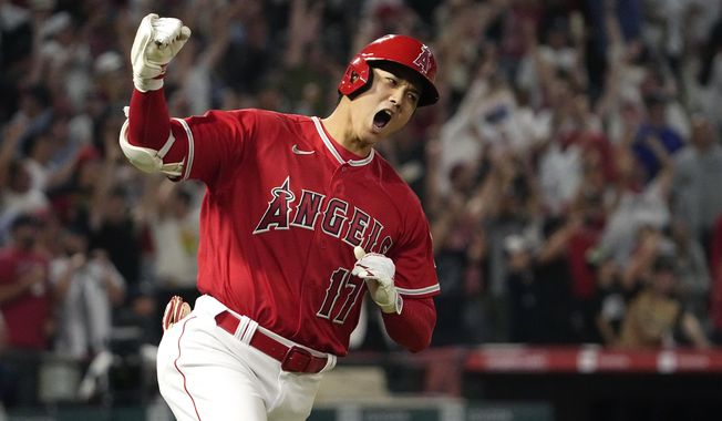 Los Angeles Angels&#x27; Shohei Ohtani celebrates as he rounds first after hitting a two-run home run during the seventh inning of a baseball game against the New York Yankees Monday, July 17, 2023, in Anaheim, Calif. (AP Photo/Mark J. Terrill)
